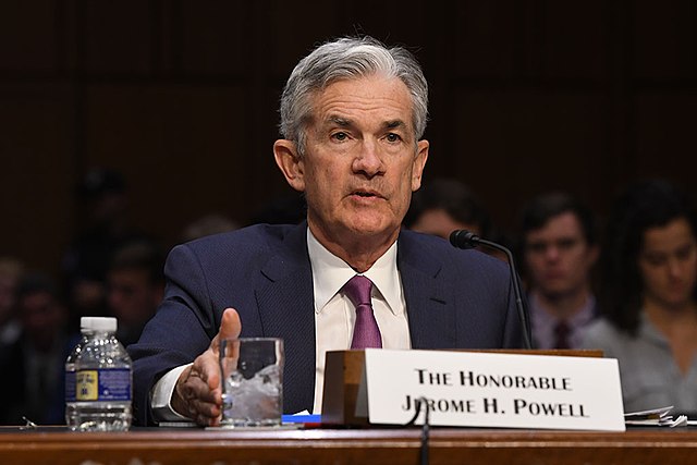 Powell Sends Dollar Lower; Stocks Remain Choppy